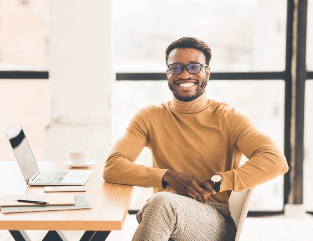 portrait-of-happy-black-manager-looking-at-camera-EAPQ4YL-scaled-e1589488586209.jpg